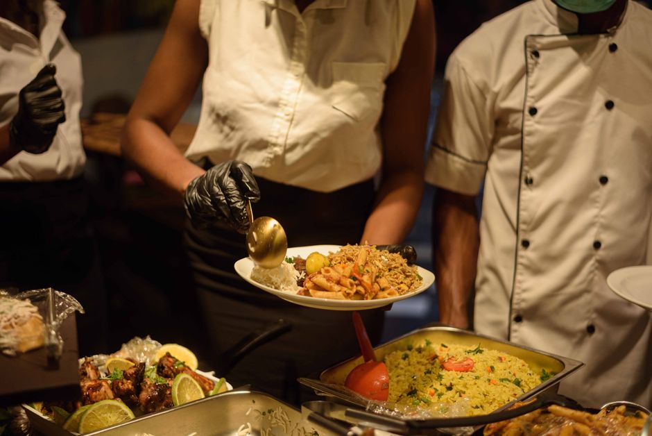 Professional catering staff serving appetizers at an event