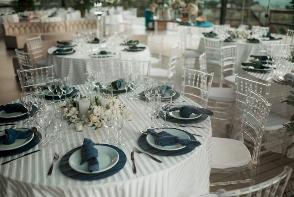 Elegant wedding reception table setting with floral arrangements